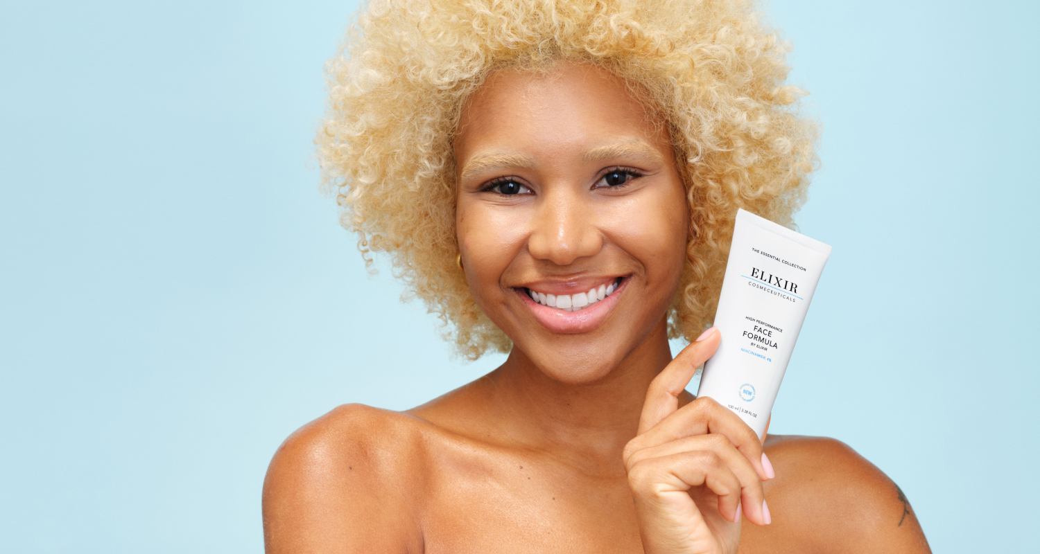 Happy woman presenting Elixir Face Formula skin cream